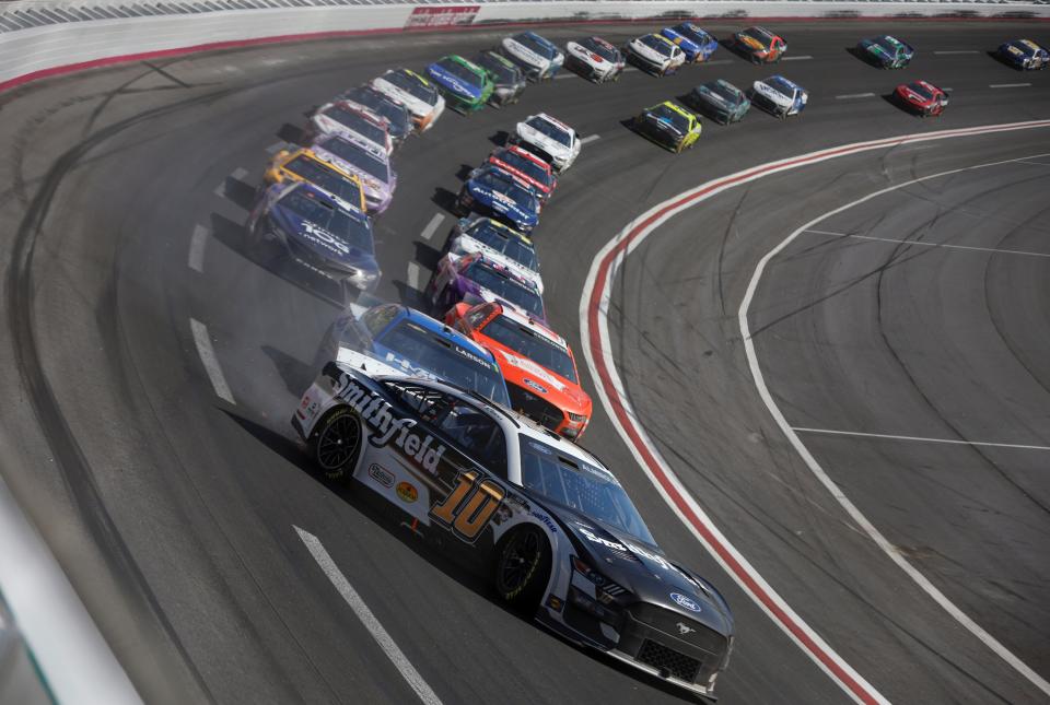 Aric Almirola (10) spins from the lead after blowing a tire late in Sunday's race at Atlanta Motor Speedway.