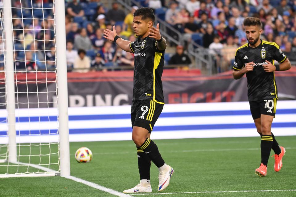 Jun 29, 2024; Foxborough, Massachusetts, USA; Columbus Crew forward Cucho Hernandez (9) celebrates with forward Diego Rossi (10) after scoring a goal against the New England Revolution during the first half at Gillette Stadium. Mandatory Credit: Eric Canha-USA TODAY Sports