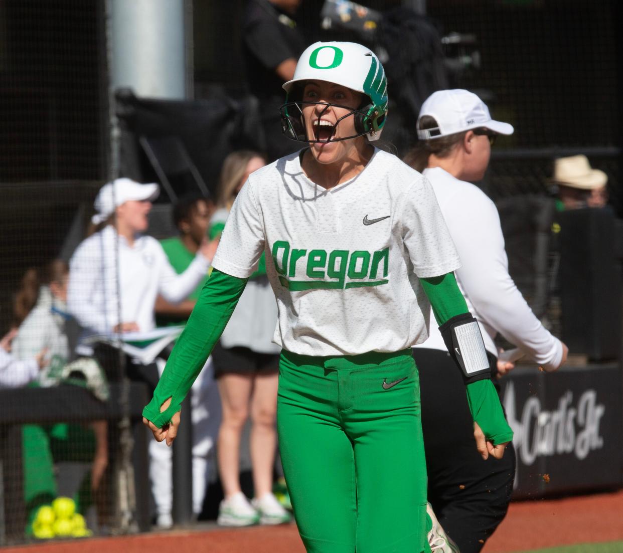 Oregon’s Kai Luschar celebrates as she runs for home off an Ariel Carlson home run hit during their game against Oregon State at Jane Sanders Stadium April 21.
