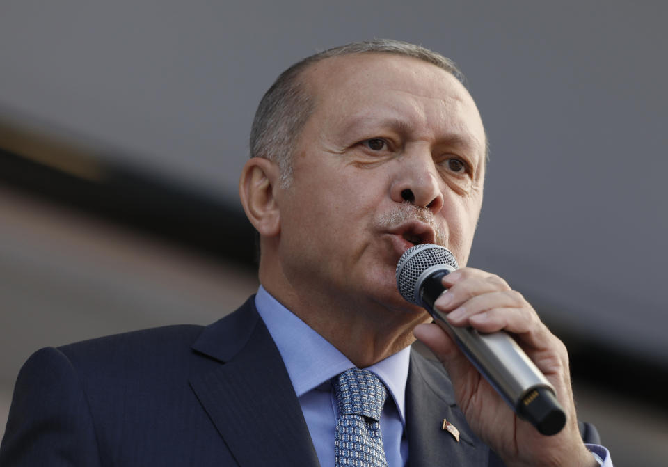 Turkey's President Recep Tayyip Erdogan addresses the supporters of his ruling Justice and Development Party, AKP, during a rally in Ankara, Turkey, Thursday, March 14, 2019. Continuing an exchange of words with the Israeli prime minister, Erdogan says Benjamin Netanyahu is "walking around with this stain" of corruption, in an interview with Haberturk television late on Thursday. (AP Photo/Burhan Ozbilici)