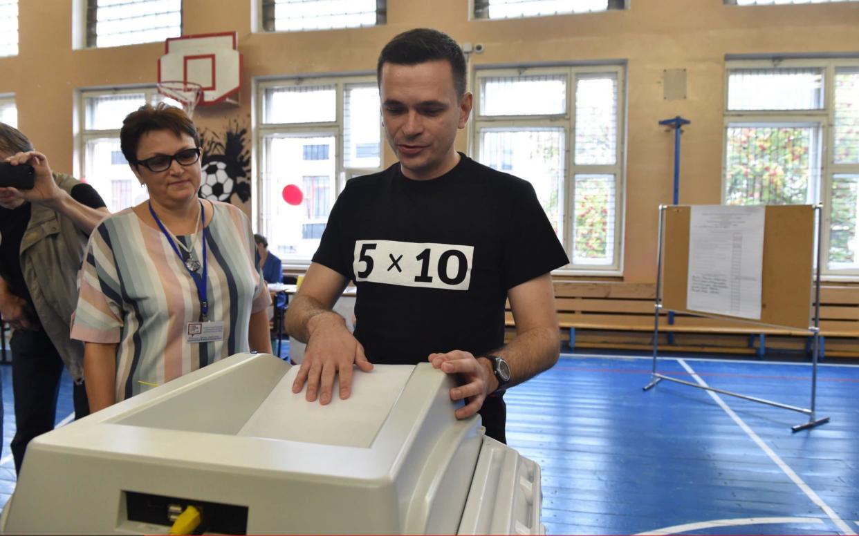 Kremlin critic Ilya Yashin, who was disqualified from the Moscow city council election and jailed for 42 days, casts his ballot for a communist candidate as part of a tactical voting campaign against the ruling party - TASS