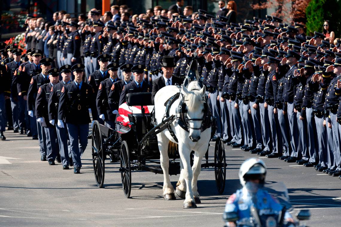 A funeral caisson transports the casket of Raleigh Police Officer Gabriel Torres to Cross Assembly Church in Raleigh, N.C. for his funeral Saturday, Oct. 22, 2022. Officer Torres was killed during a mass shooting Oct. 13.