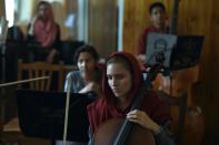 Afghan music students play during an orchestra practice session at the Afghanistan National Institute of Music in Kabul