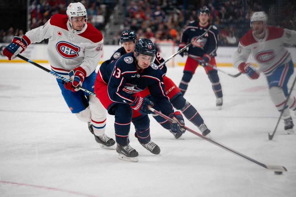 Nov 29, 2023; Columbus, Ohio, USA;
Columbus Blue Jackets left wing Johnny Gaudreau (13) races down the rink against Montreal Canadiens center Sean Monahan (91) during the third period of their game on Wednesday, Nov. 29, 2023 at Nationwide Arena.