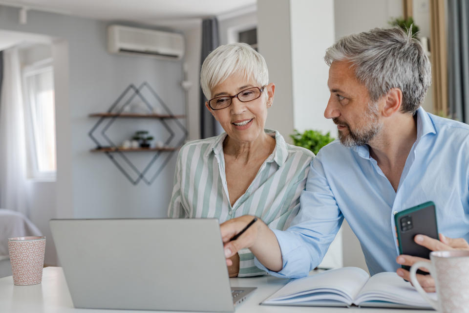 Couple at home, planning home budget together