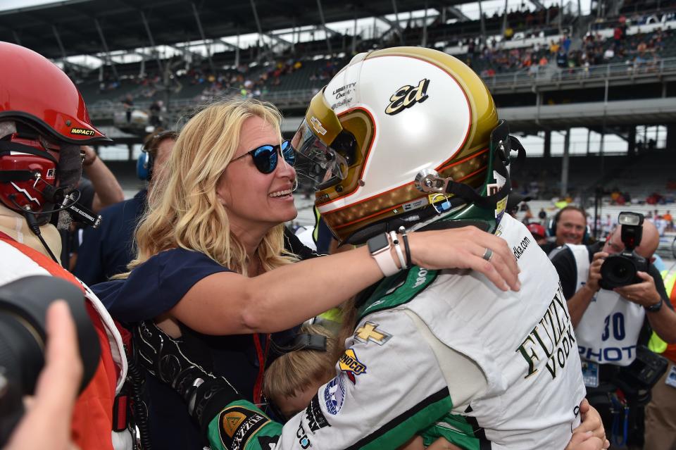 Heather Carpenter gives husband Ed a hug at the track. The couple have been married since 2005.