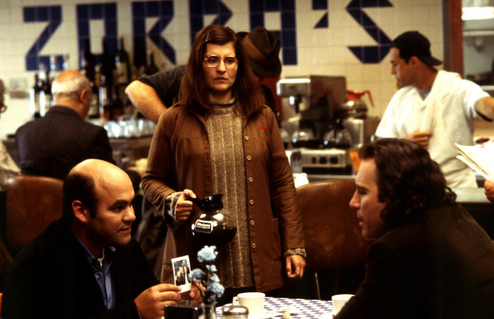 Nia Vardalos serving coffee to Ian Gomez and John Corbett.