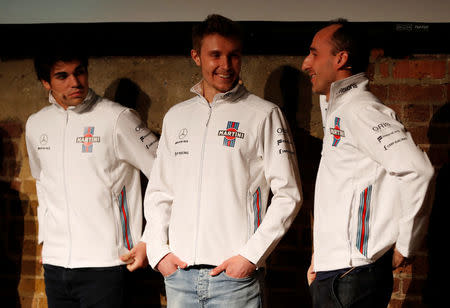 F1 Formula One - Williams Formula One Launch - London, Britain - February 15, 2018 Williams' Driver Lance Stroll, Driver Sergey Sirotkin and Reserve and Development Driver Robert Kubica during the launch Action Images via Reuters/Paul Childs