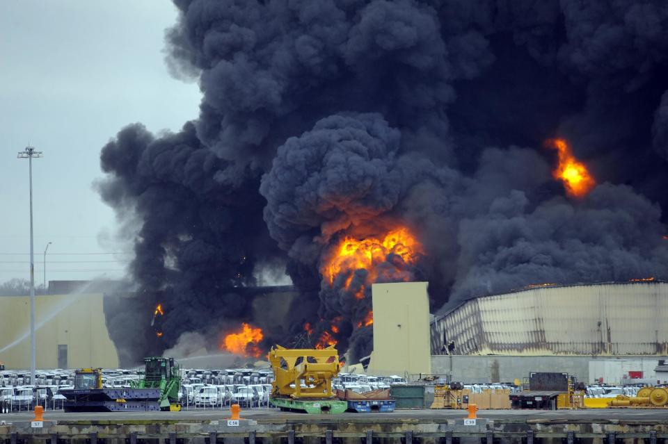 Firefighters battle a blaze in a warehouse at the Georgia Ports Authority Ocean Terminal in Savannah, Ga. on Saturday, Feb. 8, 2014. A Georgia Ports Authority spokesman said all port workers were safe and accounted for after the fire broke out. (AP Photo/Stephen B. Morton)