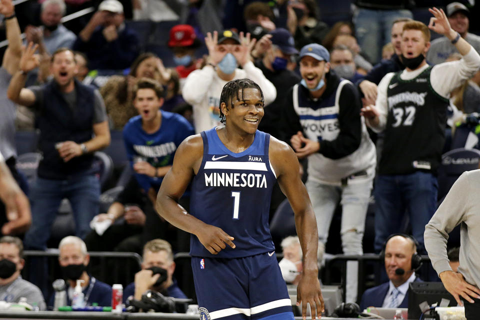 Minnesota Timberwolves forward Anthony Edwards is cheered after he hit a 3-pointer against the Houston Rockets during the first half of an NBA basketball game Wednesday, Oct. 20, 2021, in Minneapolis. (AP Photo/Andy Clayton-King)