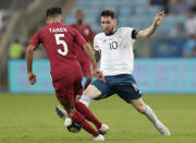 Argentina's Lionel Messi, right, fights for the ball with Qatar's Tarek Salman during a Copa America Group B soccer match at Arena do Gremio in Porto Alegre, Brazil, Sunday, June 23, 2019. (AP Photo/Silvia Izquierdo)