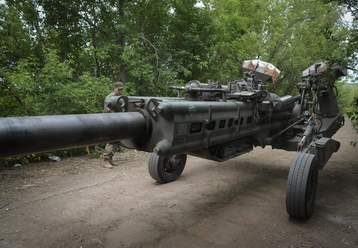 Ukrainian soldiers move a U.S.-supplied M777 howitzer into position to fire at Russian positions in Ukraine's eastern Donetsk region. (AP)