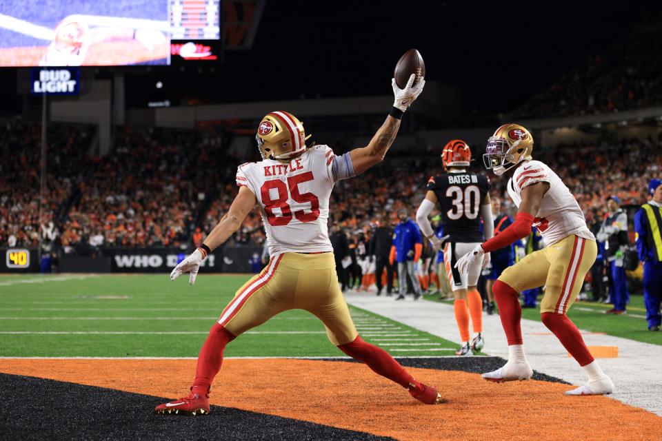 San Francisco 49ers' George Kittle (85) celebrates a touchdown reception during the first half of an NFL football game against the Cincinnati Bengals, Sunday, Dec. 12, 2021, in Cincinnati. (AP Photo/Aaron Doster)
