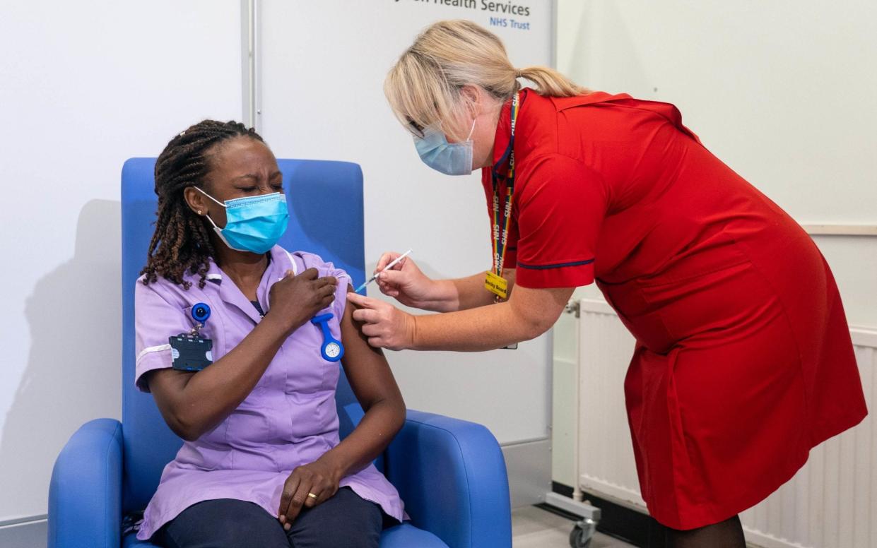 Catherine Cargill receives one of the first Covid-19 booster jabs, administered at Croydon University Hospital in south London - Dominic Lipinski / PA 