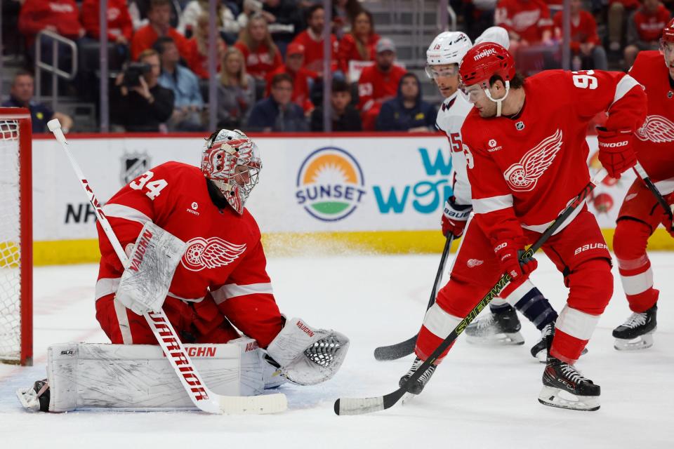 Red Wings goaltender Alex Lyon makes a save in the first period against the Capitals on Tuesday, April 9, 2024, at Little Caesars Arena.