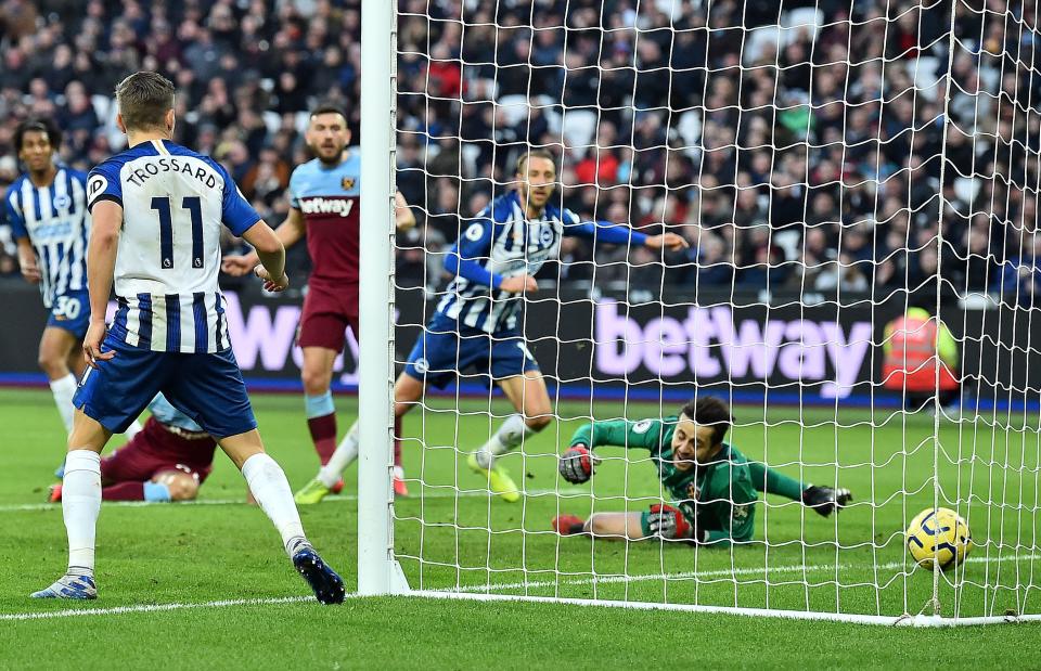 West Ham United's Polish goalkeeper Lukasz Fabianski (R) reacts as Brighton's English striker Glenn Murray scores his team's third goal during the English Premier League football match between West Ham United and Brighton and Hove Albion at The London Stadium, in east London on February 1, 2020. (Photo by Glyn KIRK / AFP) / RESTRICTED TO EDITORIAL USE. No use with unauthorized audio, video, data, fixture lists, club/league logos or 'live' services. Online in-match use limited to 120 images. An additional 40 images may be used in extra time. No video emulation. Social media in-match use limited to 120 images. An additional 40 images may be used in extra time. No use in betting publications, games or single club/league/player publications. /  (Photo by GLYN KIRK/AFP via Getty Images)
