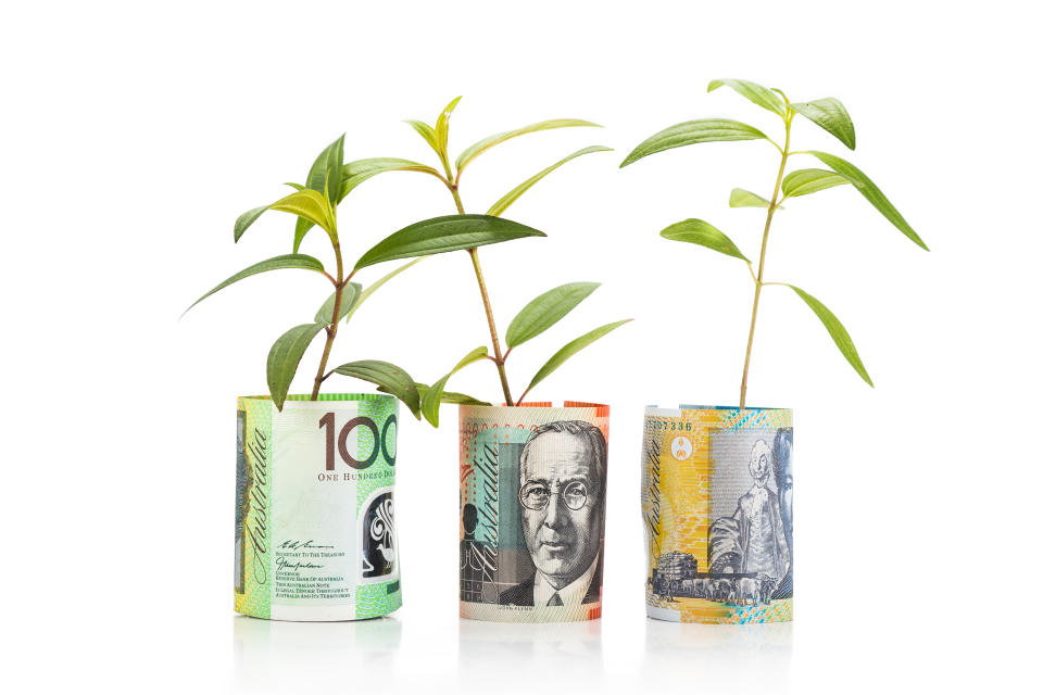 Concept of green plant grow on Australian Dollar currency note.