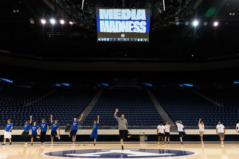 Members of the media are led in stretches at Media Madness, an event hosted by the BYU men’s basketball program, at the Marriott Center in Provo on Monday, Oct. 9, 2023. | Megan Nielsen, Deseret News