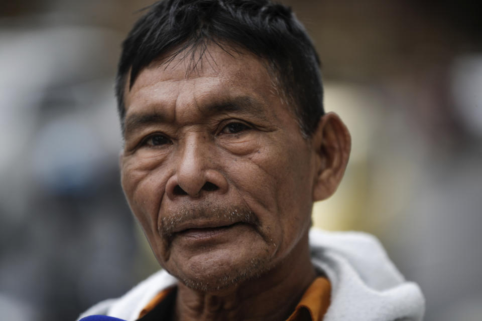 Narciso Mucutuy, the grandfather of the 4 rescued Indigenous children, speaks to the media from the entrance of the military hospital where the children who survived an Amazon plane crash that killed three adults and then braved the jungle for 40 days before being found alive, are receiving medical attention, in Bogota, Colombia, Sunday, June 11, 2023. (AP Photo/Ivan Valencia)