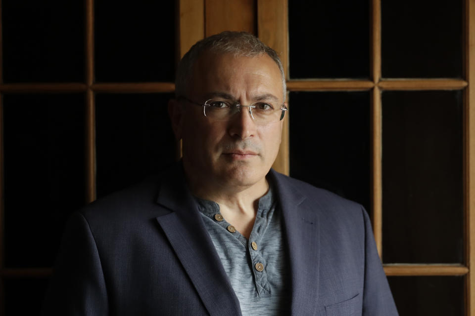 Russian opposition figure Mikhail Khodorkovsky, the former owner of the Yukos Oil Company, poses for a photograph after being interviewed by The Associated Press in London, Tuesday, July 24, 2018. Khodorkovsky’s London-based investigative unit, the Dossier Center, is compiling profiles of Russians it accuses of benefiting from corruption with an eye toward their eventual prosecution. (AP Photo/Matt Dunham)