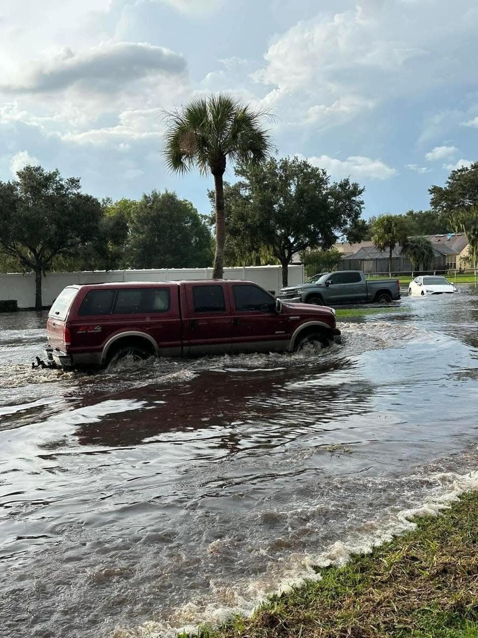 Imperial Lake residents with SUVs and trucks braved the flooded Imperial Lakes Boulevard Thursday afternoon to help get hundreds of residents back safely to their homes. Many are concerned the roads pose an impassible safety hazard.