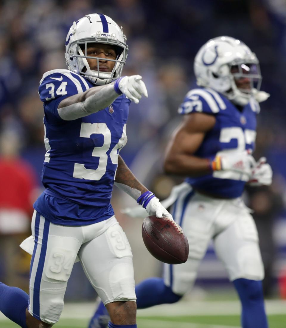 Indianapolis Colts cornerback Isaiah Rodgers (34) celebrates as he walks off the field the ball after intercepting a pass Sunday, Jan. 2, 2022, during a game against the Las Vegas Raiders at Lucas Oil Stadium in Indianapolis.