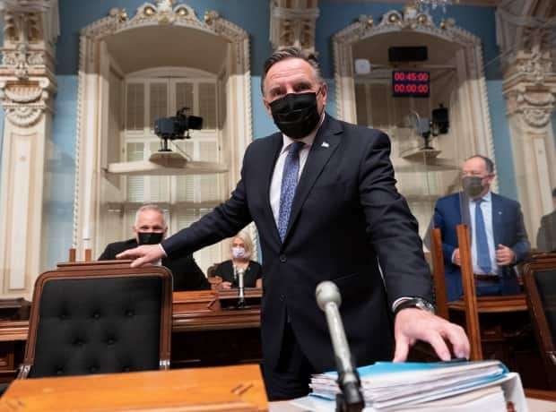 Quebec Premier Francois Legault walks in for question period Thursday, September 23, 2021 at the National Assembly Quebec City. His government tabled a bill to outlaw protests near places such as schools, hospitals and COVID-19 vaccination sites. (Jacques Boissinot/The Canadian Press - image credit)