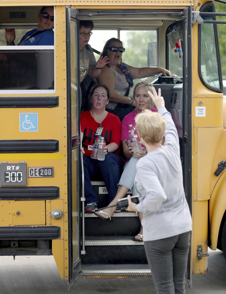 <p>School staff members sit in a school bus to be transported to another school after a shooting at the Santa Fe High School in Santa Fe, Texas, on Friday morning, May 18, 2018. (Photo: Jennifer Reynolds/The Galveston County Daily News via AP) </p>