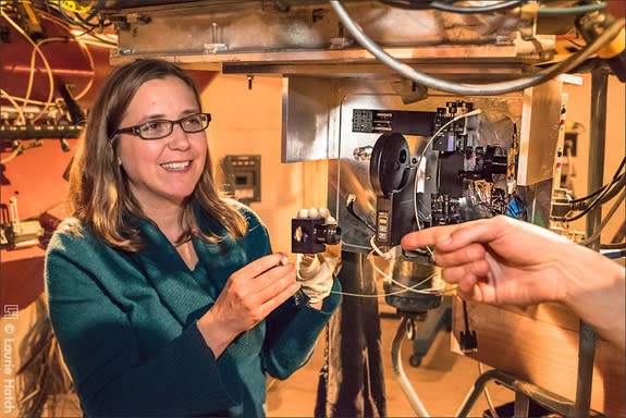 Shelley Wright, an Assistant Professor of Physics at the University of California, San Diego, led the development of the near-infrared optical SETI (NIROSETI) instrument. Wright holds a fiber that emits infrared light for calibration of the det