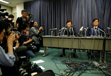 Mitsubishi Motors Corp Chairman of the Board and CEO Osamu Masuko (R) and President Tetsuro Aikawa attend a news conference in Tokyo, Japan, May 11, 2016. REUTERS/Toru Hanai