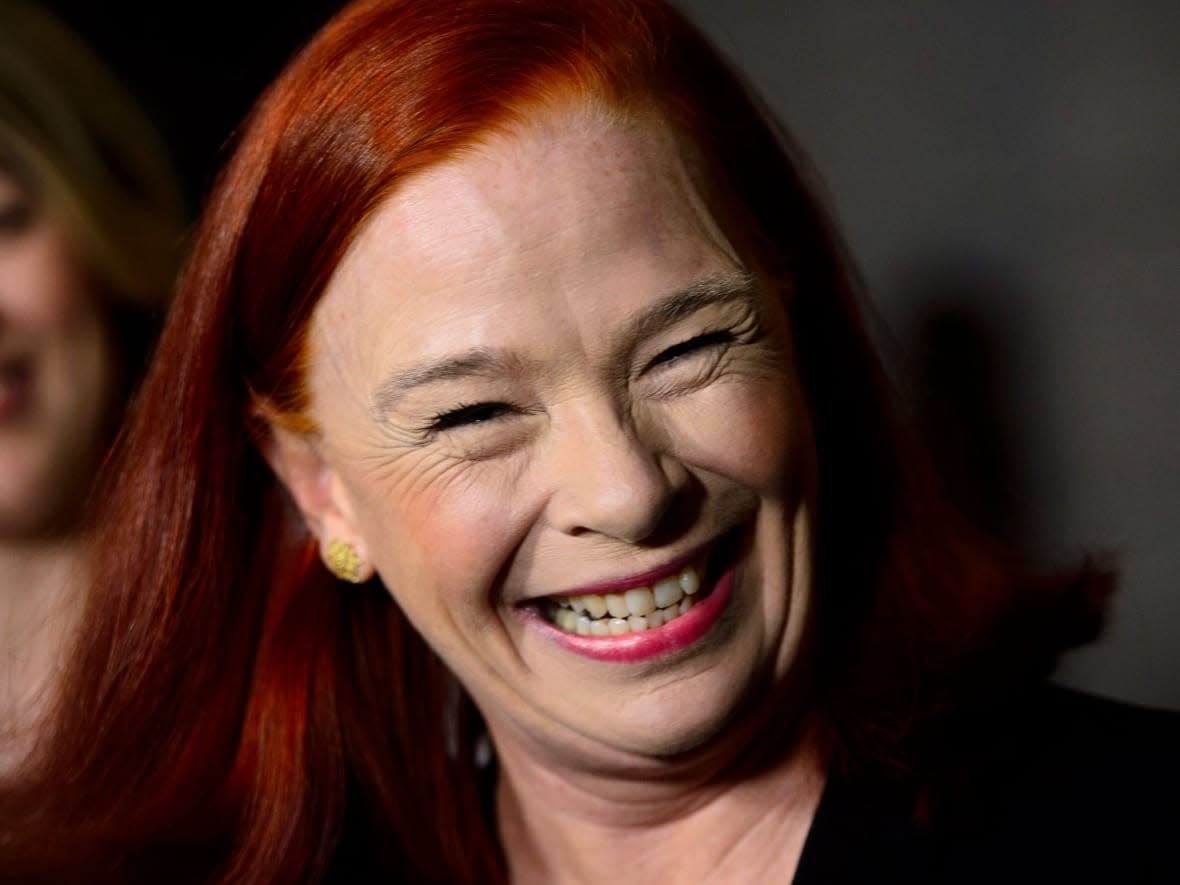 Catherine Tait, right, smiles as Heritage Minister Melanie Joly announces her appointment as the new president and CEO of CBC/Radio-Canada in Ottawa on Tuesday, April 3, 2018. Tait has been renewed for 18 months.  (Sean Kilpatrick/Canadian Press - image credit)