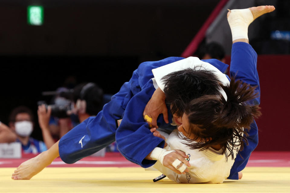 Italy's Francesca Milani (white) competes with Taiwan's Chen-Hao Lin during their judo women's -48kg elimination round bout during the Tokyo 2020 Olympic Games at the Nippon Budokan in Tokyo on July 24, 2021. / AFP / Jack GUEZ