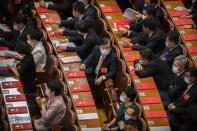Delegates wait for the closing session of China's National People's Congress (NPC) at the Great Hall of the People in Beijing, Thursday, May 28, 2020. China's ceremonial legislature has endorsed a national security law for Hong Kong that has strained relations with the United States and Britain. (AP Photo/Mark Schiefelbein)