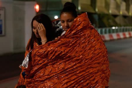 People flee as police attend to an incident near London Bridge in London, Britain, June 4, 2017. REUTERS/Hannah McKay