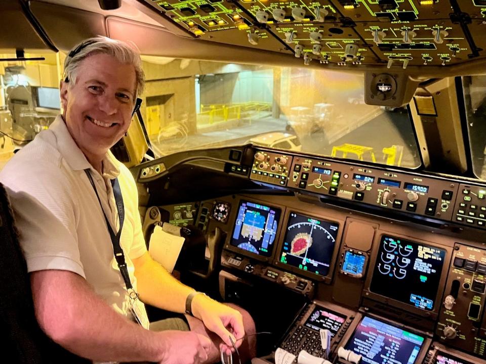 Captain Vince Eckelkamp in the cockpit of the plane as he prepares to fly out of Maui.