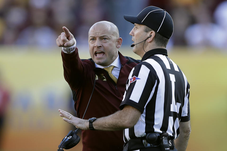 Minnesota head coach P.J. Fleck points at the screen as he yells at line judge Jim Slayton during the second half of the Outback Bowl NCAA college football game against Auburn Wednesday, Jan. 1, 2020, in Tampa, Fla. (AP Photo/Chris O'Meara)