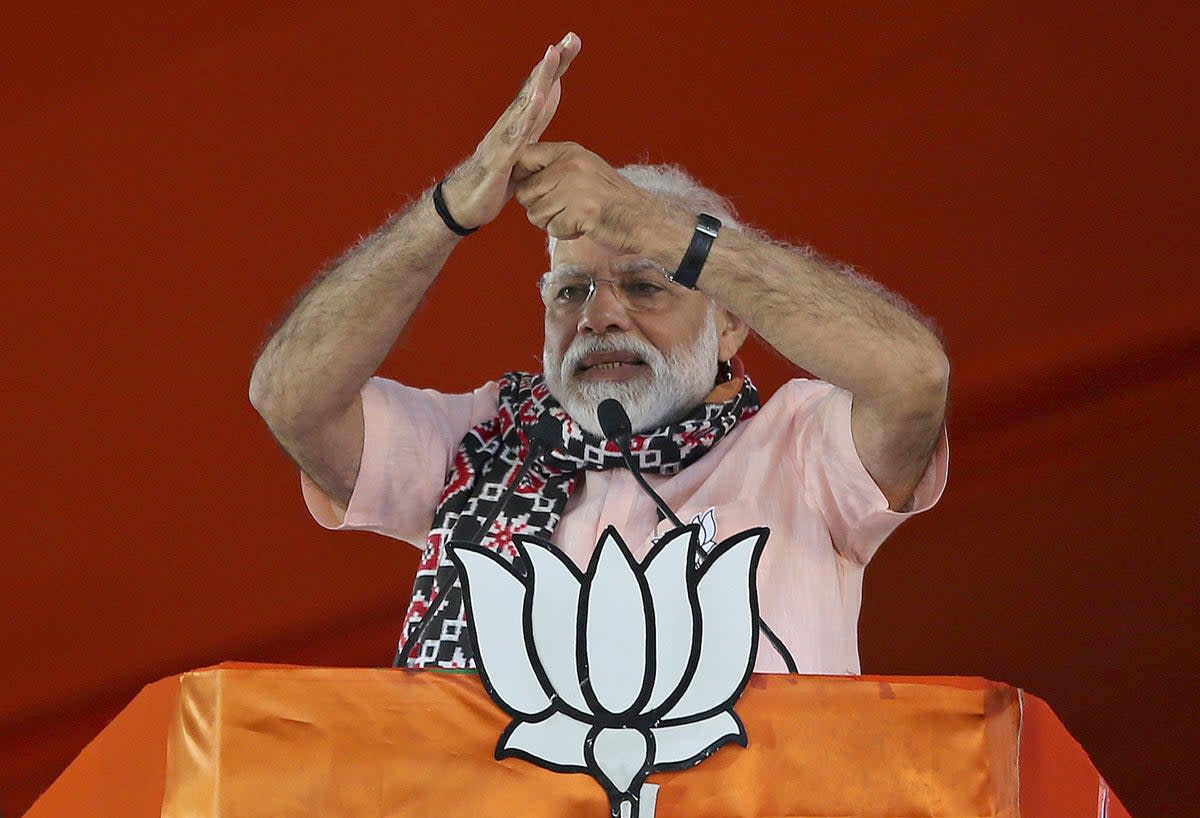 Indian Prime Minister Narendra Modi gestures as he speaks during an election campaign rally of his Bharatiya Janata Party (BJP)  (AP)