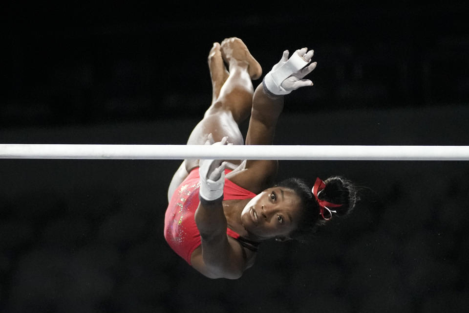 Simone Biles, a seven-time Olympic medalist and the 2016 Olympic champion, practices on the uneven bars at the U.S. Classic gymnastics competition Friday, Aug. 4, 2023, in Hoffman Estates, Ill. (AP Photo/Morry Gash)