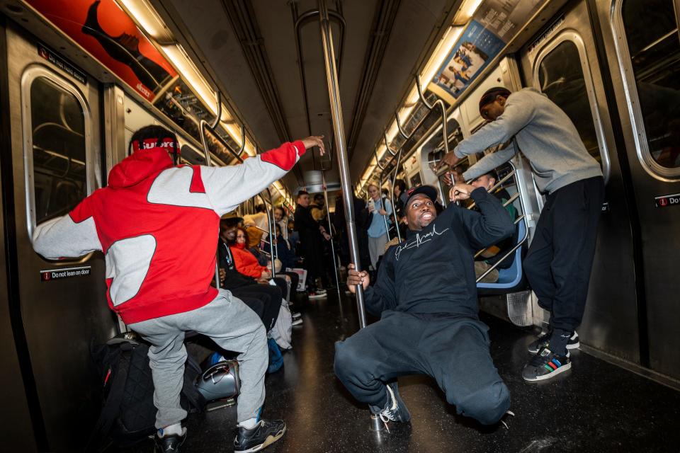 Members of W.A.F.F.L.E., the world's most successful Litefeet dance crew, perform on the New York City subway on Wednesday, November 16, 2022. (From left) Doc Jr., Moe Black and Astro.