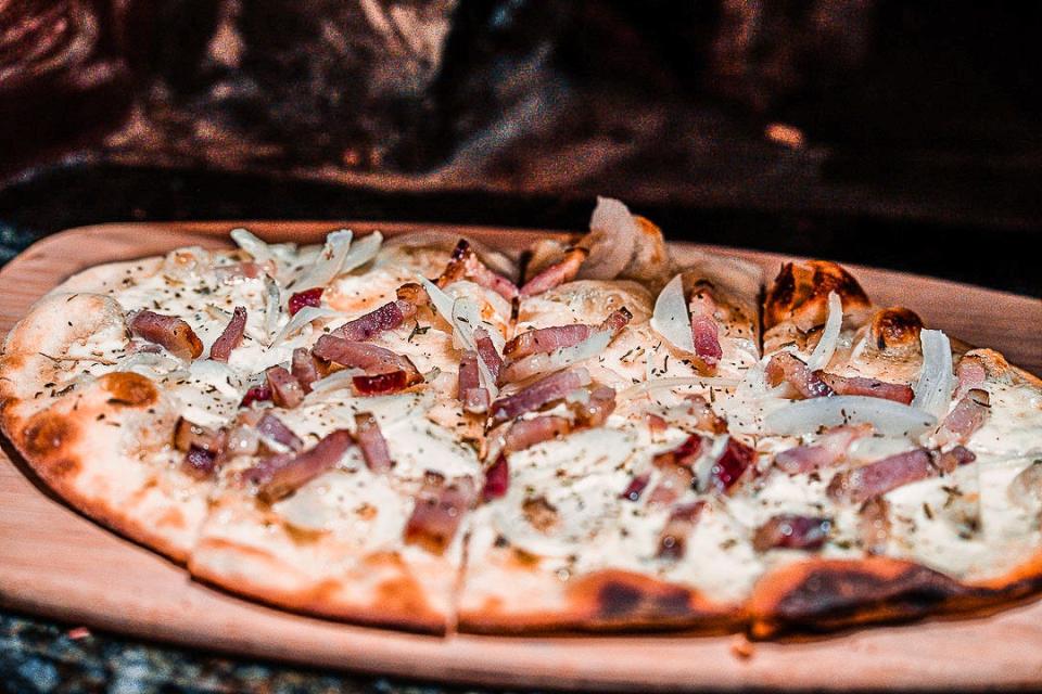 A flatbread with creme fraiche, onions and bacon is the most popular at La Goulue.