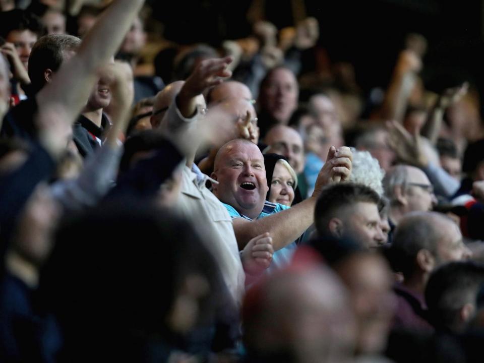 Brentford fans celebrate after Ariel Borysiuk scored the visitors' opener (Getty)