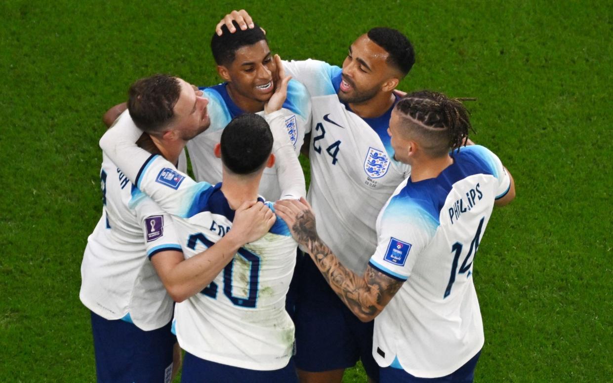 Marcus Rashford celebrates/Southgate warns 'big business starts now': how football world reacted to England reaching last 16 - AFP