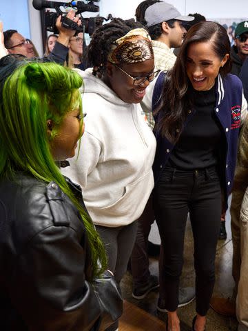 <p>Lee Morgan for The Archewell Foundation</p> Meghan Markle chats with students at The Marcy Lab School on Oct. 10