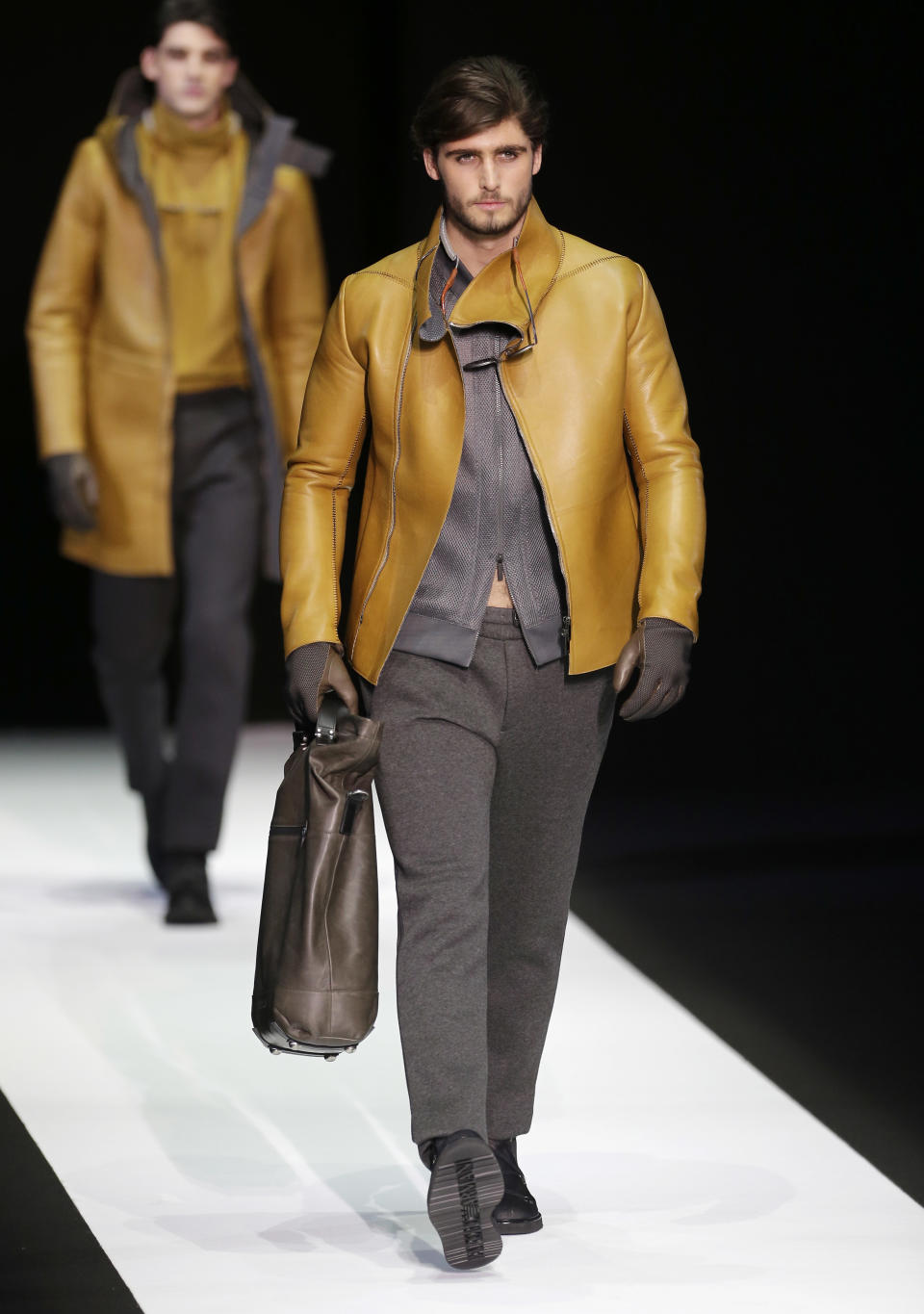 A model wears a creation for Emporio Armani men's Fall-Winter 2013-14 collection, part of the Milan Fashion Week, unveiled in Milan, Italy, Monday, Jan. 14, 2013. (AP Photo/Antonio Calanni)