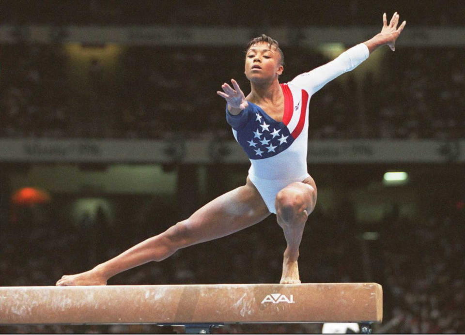 ATLANTA, UNITED STATES:  US Olympic team gymnast Dominique Dawes practices on the balance beam during a training session 16 July at the Georgia Dome in Atlanta. The 26th Summer Olympic Games are scheduled to open 19 July in Atlanta.       AFP PHOTO/Eric FEFERBERG (Photo credit should read ERIC FEFERBERG/AFP/Getty Images)