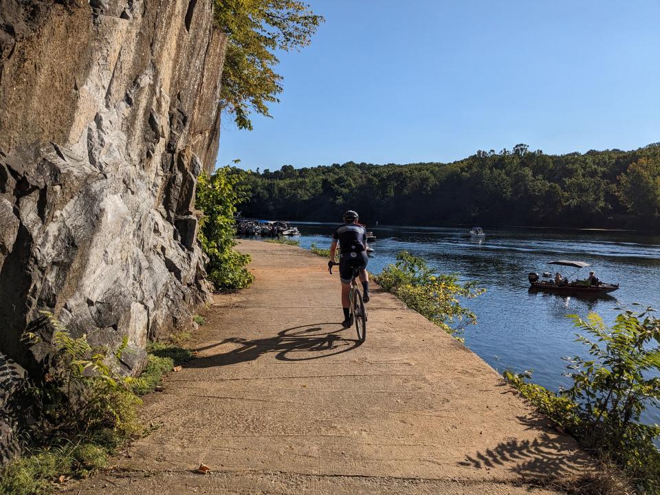 Dennis Romboy rides on the C&O Canal trail next to the Potomac River. | Marcus Romboy, for the Deseret News