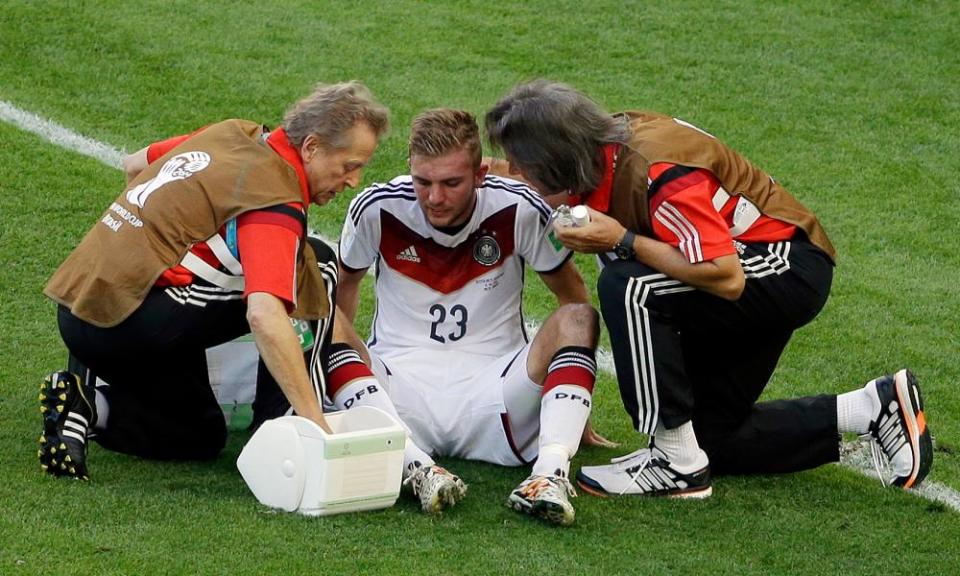 Germany’s Christoph Kramer is treated by doctors in the World Cup final. He was allowed to play on, and subsequently admitted to having little memory of the game.