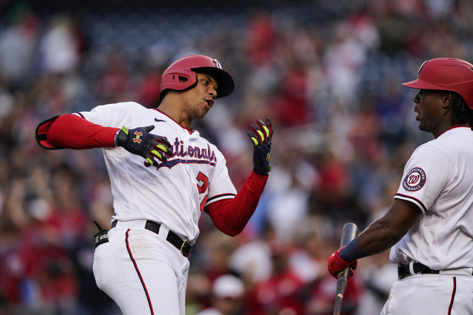 Washington Nationals' Juan Soto celebrates his two-run home with Josh Bell during the first inning of a baseball game against the New York Mets at Nationals Park, Wednesday, May 11, 2022, in Washington. (AP Photo/Alex Brandon)