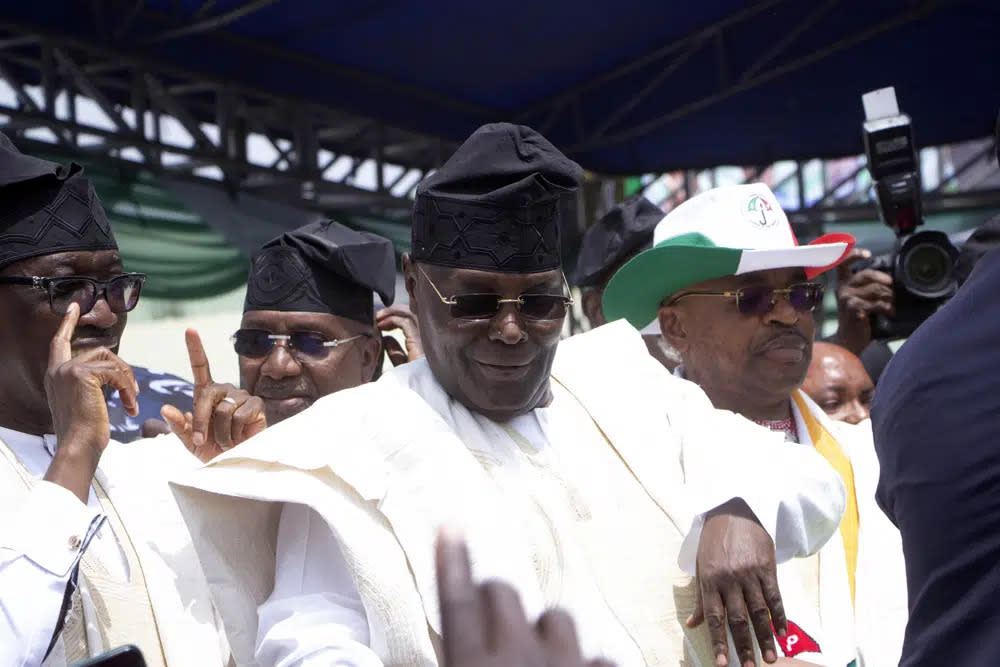 Atiku Abubakar, presidential candidate of the People’s Democratic party, Nigeria’s opposition party, center, speaks with his supporters during a presidential election campaign rally in Yola Nigeria, Saturday, Feb. 18, 2023. (AP Photo/Radeno Haniel)