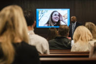 Anna Moriah Wilson's photo is displayed on the screen as state attorney Rickey Jones addresses the jury during the sentencing portion of Kaitlin Armstrong's murder trial at the Blackwell-Thurman Criminal Justice Center on Friday, Nov. 17, 2023 in Austin, Texas. Prosecutors are seeking a prison sentence of at least 40 years for Armstrong convicted of murder in the shooting death of rising professional cyclist Anna Moriah Wilson. (Mikala Compton/Austin American-Statesman via AP, Pool)